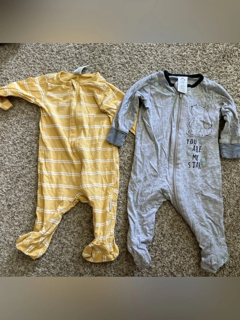 Two one-piece zipper footed pajamas